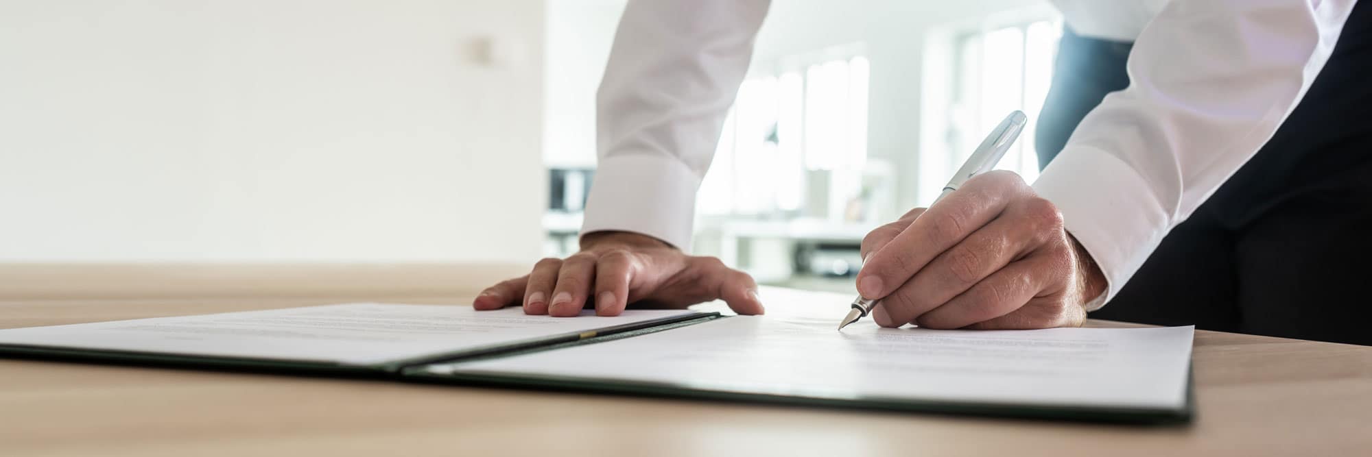 Real estate and strata documents on a desk